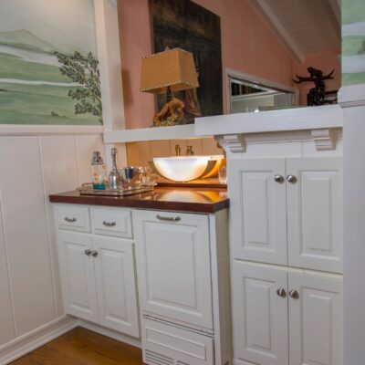 Beautifully designed kitchen with extensive white cabinetry