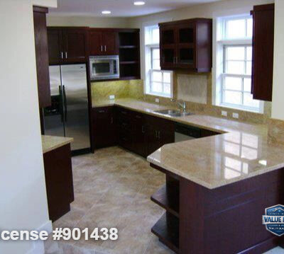 Cohesive countertop and cabinetry design in the renovated kitchen.
