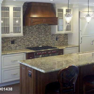 Bright lighting illuminating the polished kitchen surfaces.