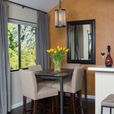 Transitional kitchen with dark wood cabinetry and light countertops.