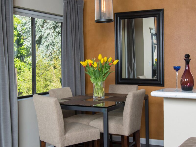 Transitional kitchen with dark wood cabinetry and light countertops.