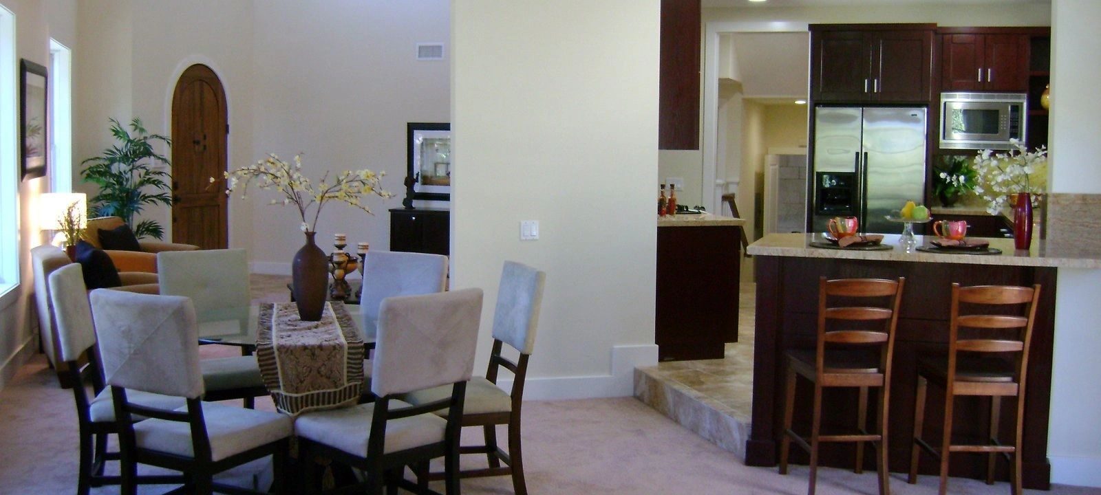 Custom staircase with elegant railings leading to the upper level